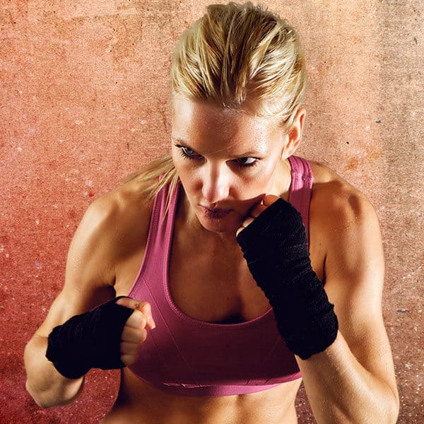 Mixed Martial Arts Lessons for Adults in Lewisville TX - Lady Kickboxing Focused Background