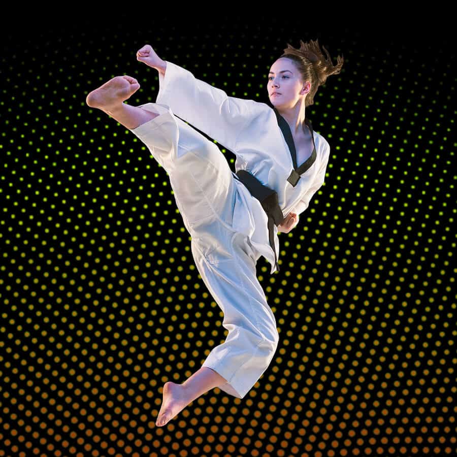 Martial Arts Lessons for Adults in Lewisville TX - Girl Black Belt Jumping High Kick